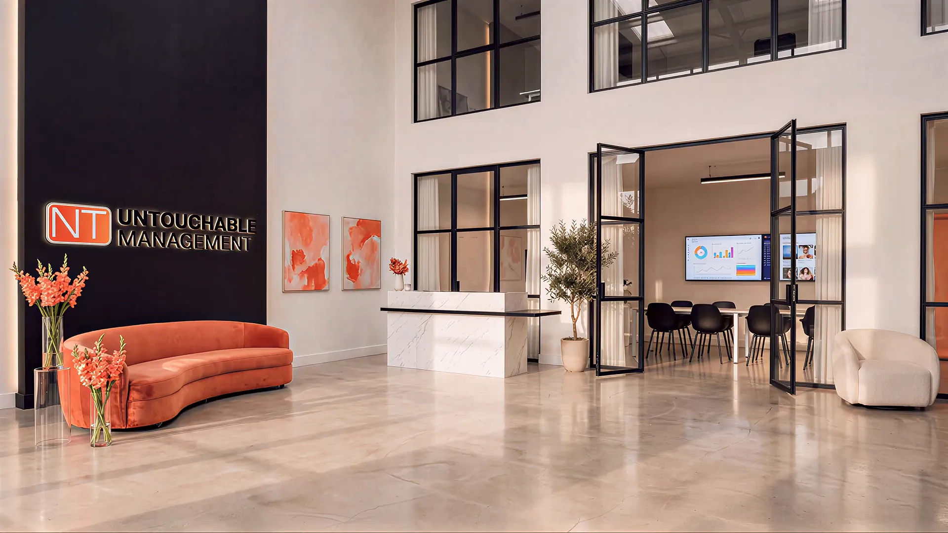 Lobby von Untouchable Management mit dem Logo an der Wand